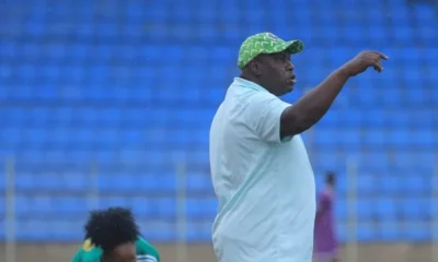 Super Falcons head coach Justine Madugu giving instructions on the sidelines during a match