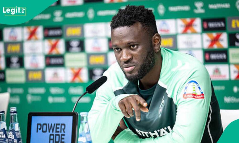 Victor Boniface smiling during a press conference after defending his social media activity