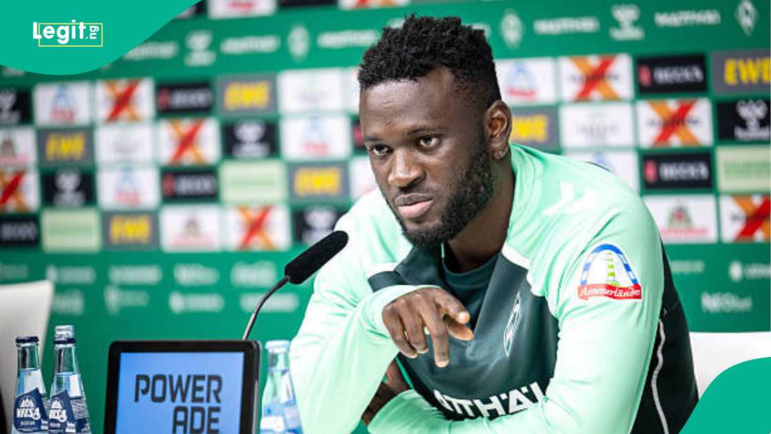 Victor Boniface smiling during a press conference after defending his social media activity