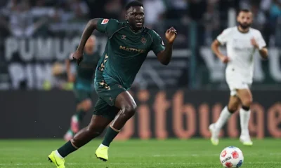 Victor Boniface training with Werder Bremen teammates during Bundesliga warm-up session.