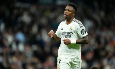 Vinicius Jr celebrating a goal for Real Madrid amid contract negotiations