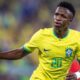 Vinicius Junior celebrating a goal for Brazil during an international match.
