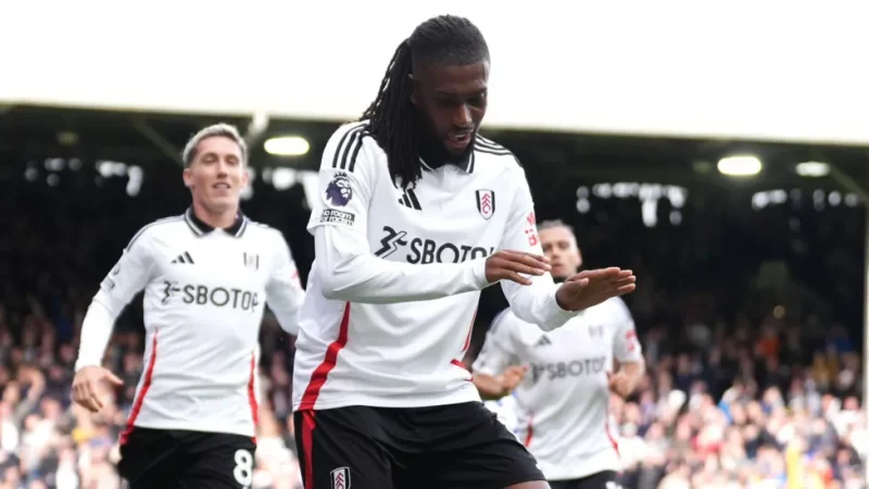 Alex Iwobi celebrating after scoring for Fulham against Manchester City at Craven Cottage.