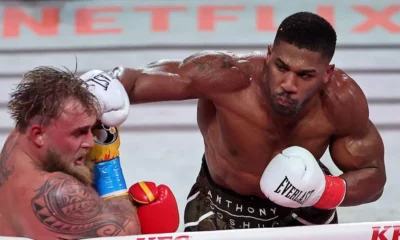 Anthony Joshua delivers a knockout punch to Jake Paul during their six-round boxing match at Miami’s Kaseya Center.