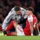 Ben White receiving treatment during Arsenal vs Wolves at the Emirates Stadium