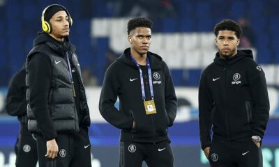 Estevao Willian looking frustrated on the Chelsea bench during a match