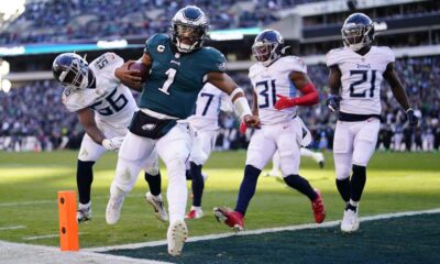 Jalen Hurts attempting a pass during an NFL game for the Philadelphia Eagles.