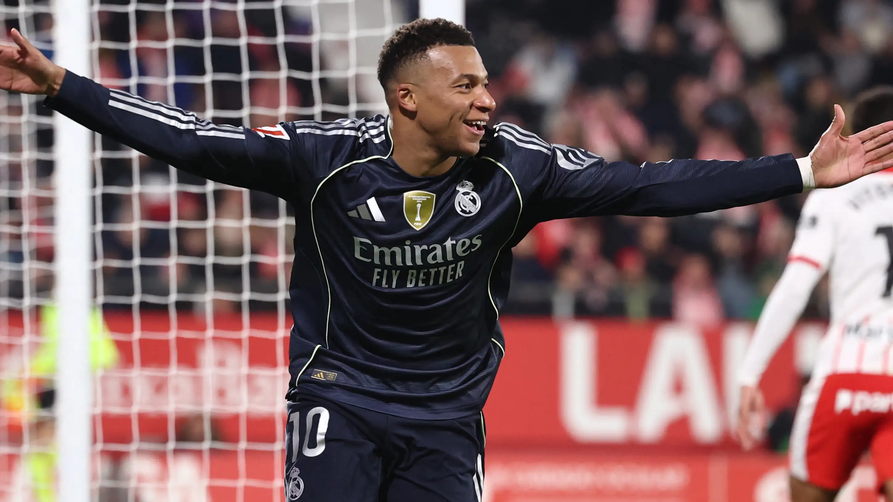 Kylian Mbappe celebrating a goal for Real Madrid, marking his 60th goal in 2025.