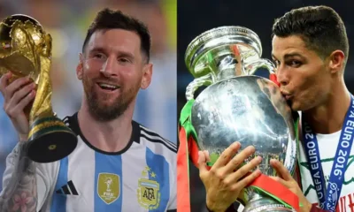 Lionel Messi and Cristiano Ronaldo side-by-side during an international match.