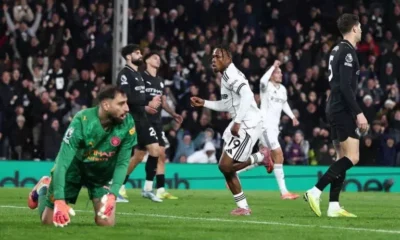 Manchester City defenders reacting during a Premier League match against Fulham.