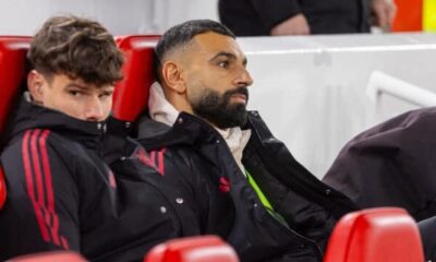 Mohamed Salah sitting on Liverpool bench during Premier League match