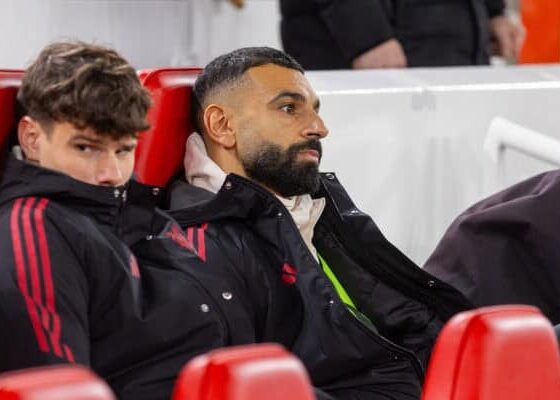 Mohamed Salah sitting on Liverpool bench during Premier League match