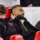 Mohamed Salah sitting on Liverpool bench during Premier League match