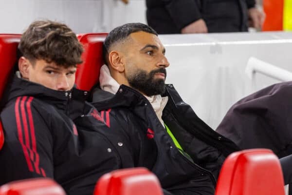 Mohamed Salah sitting on Liverpool bench during Premier League match