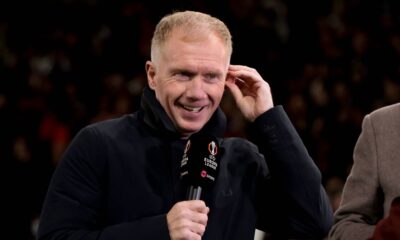 Paul Scholes speaking on a football podcast with Premier League graphics in the background.