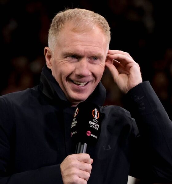 Paul Scholes speaking on a football podcast with Premier League graphics in the background.