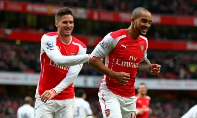 Theo Walcott watching Arsenal during a Premier League match at the Emirates Stadium