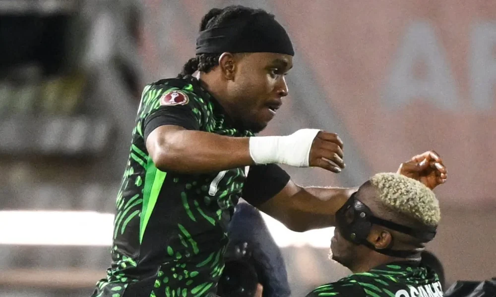 Ademola Lookman celebrating a goal for Nigeria at AFCON 2025 with Super Eagles fans cheering