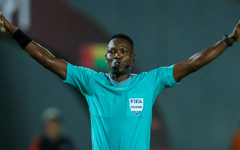 Ghanaian referee Daniel Laryea overseeing a football match, appointed for Nigeria vs Morocco AFCON 2025 semi-final