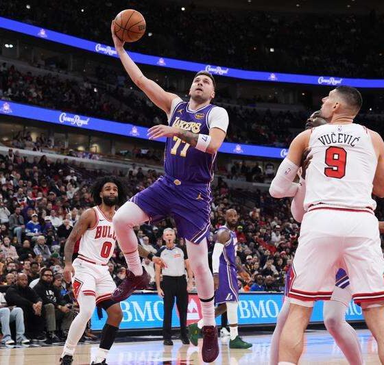Luka Doncic celebrates after scoring against the Chicago Bulls for the Los Angeles Lakers