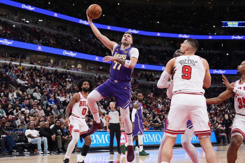 Luka Doncic celebrates after scoring against the Chicago Bulls for the Los Angeles Lakers
