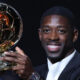 Ousmane Dembele holding the Ballon d’Or in PSG colours