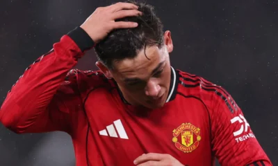 Shea Lacey walking off the pitch after being shown red card against Brighton