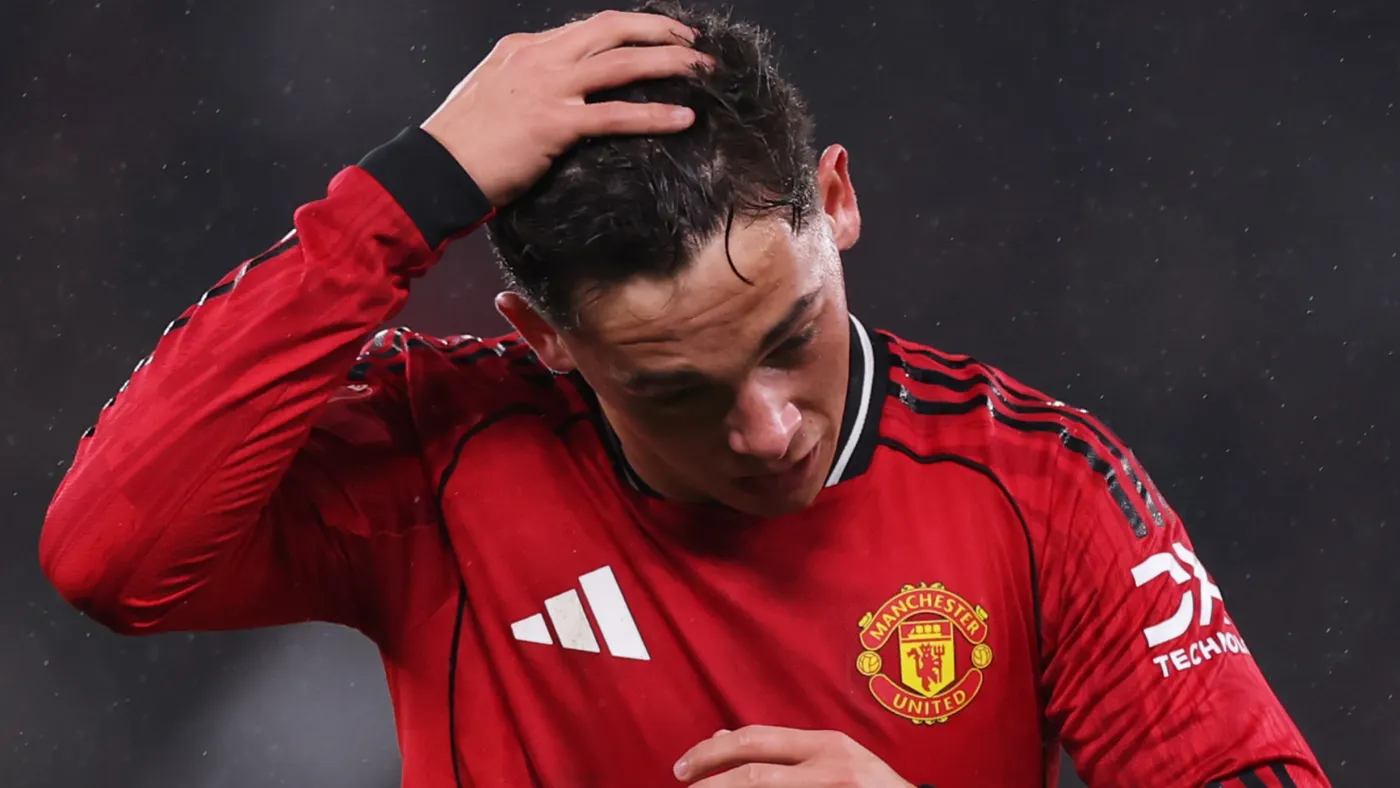 Shea Lacey walking off the pitch after being shown red card against Brighton