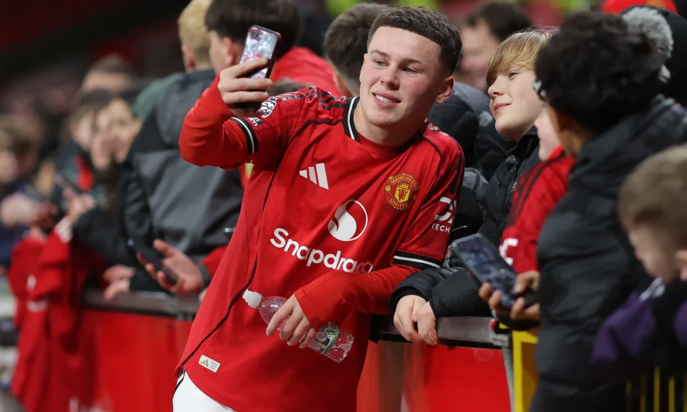 Wayne Rooney watching Kai Rooney play for Manchester United at Old Trafford