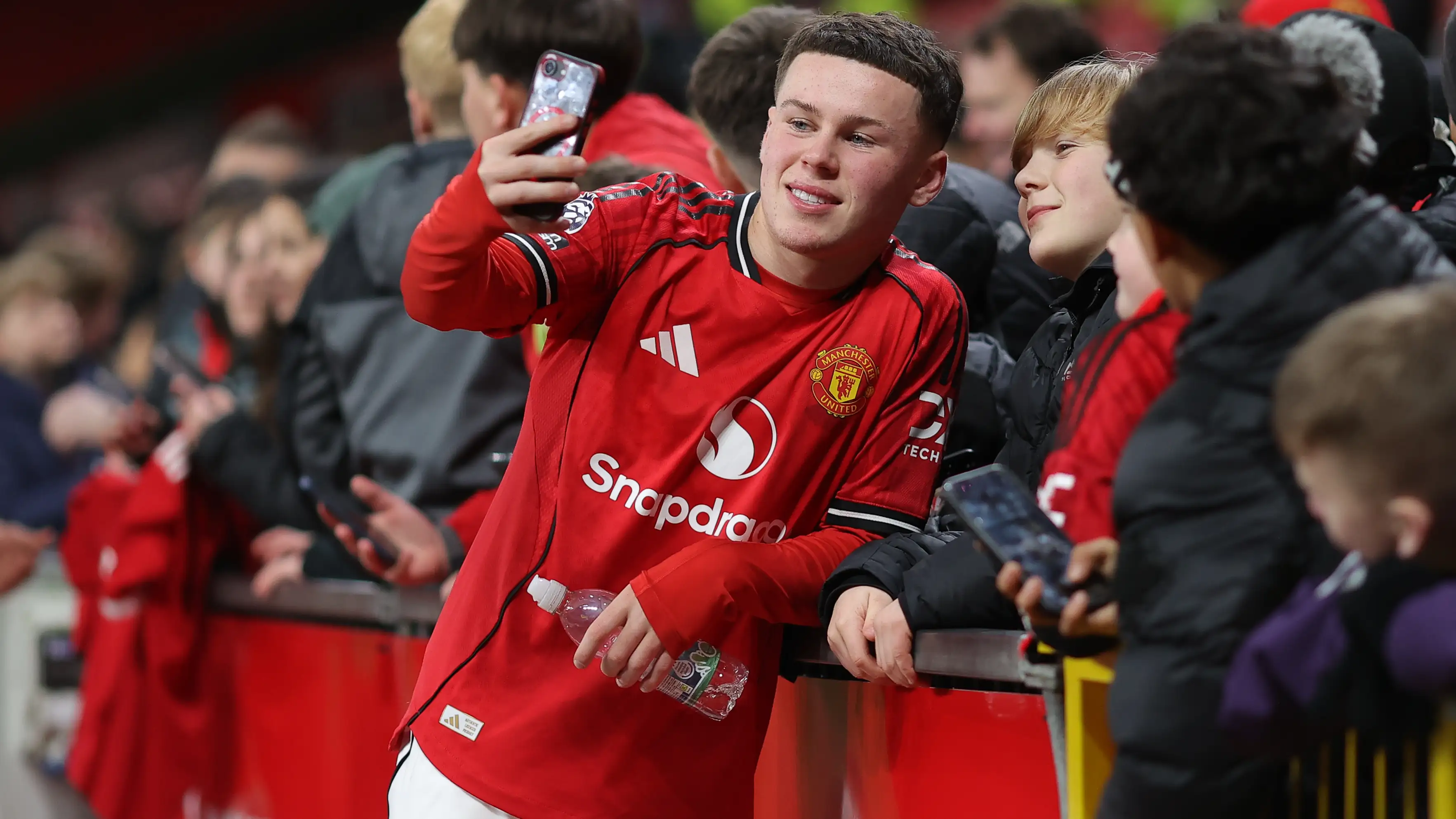 Wayne Rooney watching Kai Rooney play for Manchester United at Old Trafford