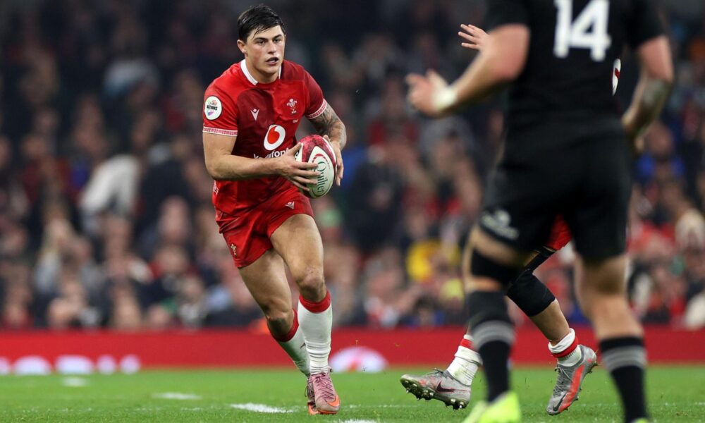 Louis Rees-Zammit Carrying The Ball For Wales During International Match