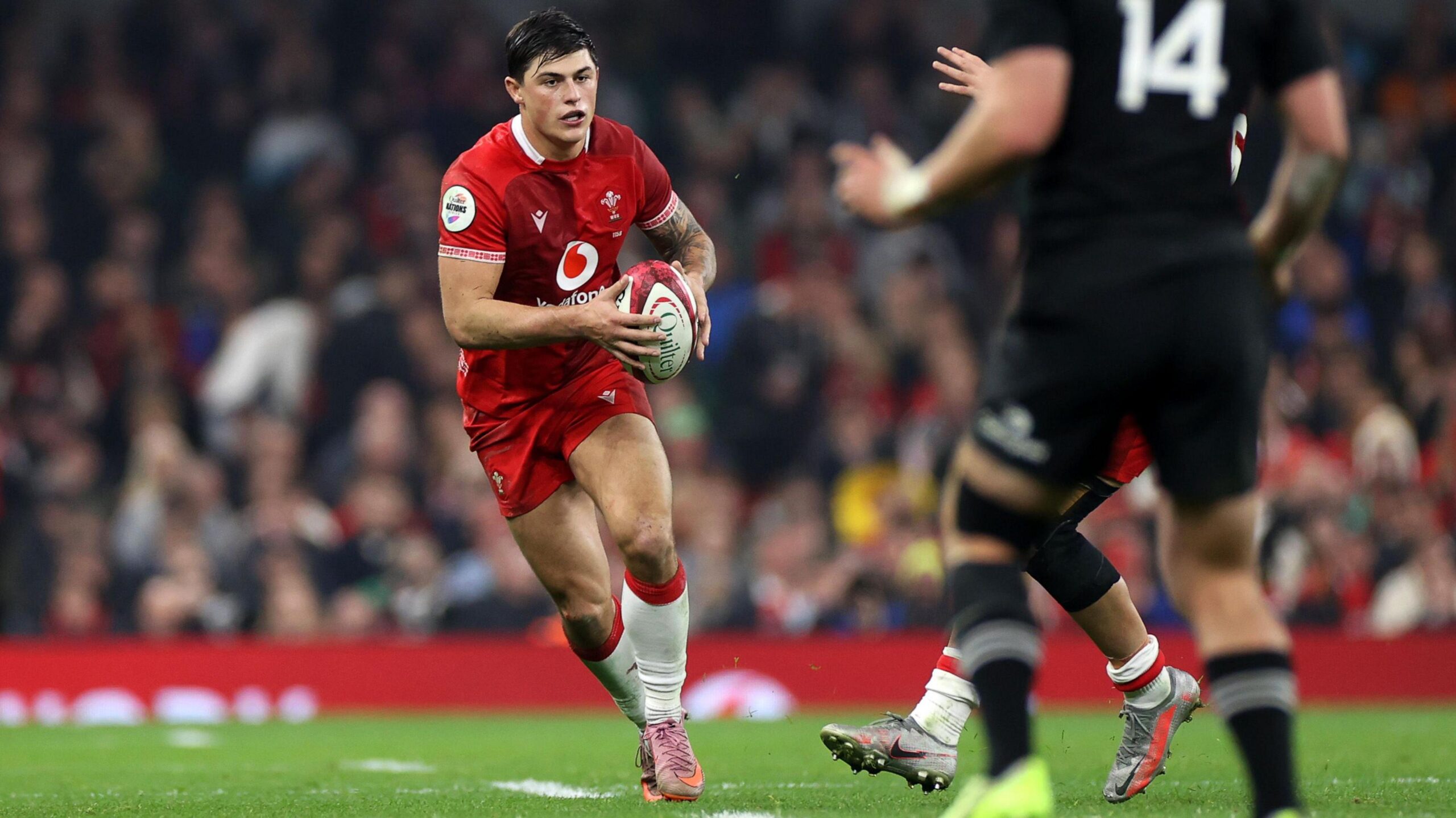 Louis Rees-Zammit Carrying The Ball For Wales During International Match