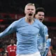 Erling Haaland celebrates winning goal at Anfield for Manchester City
