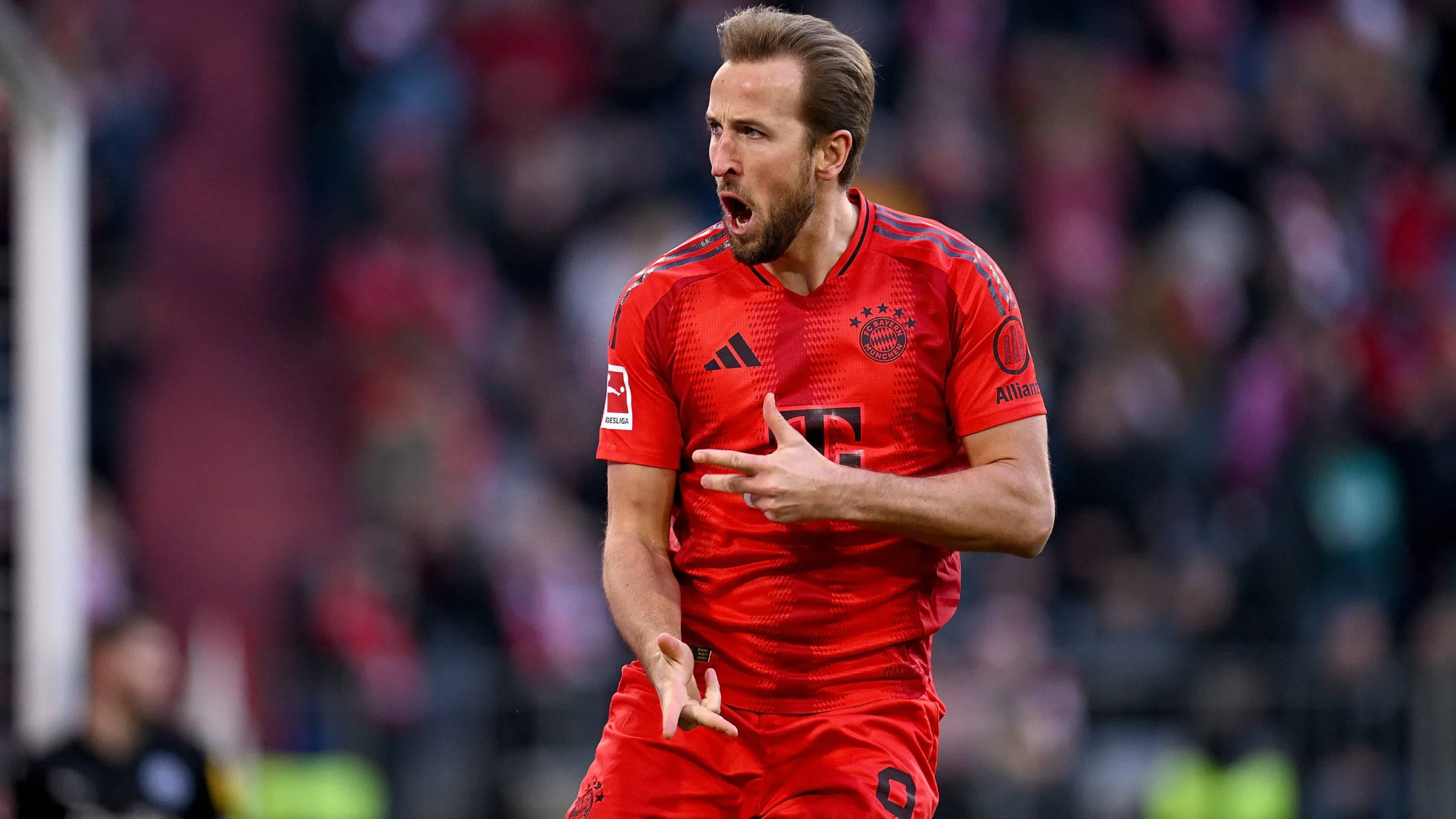Harry Kane in Bayern Munich kit celebrating a goal in the Bundesliga 2025-26 season