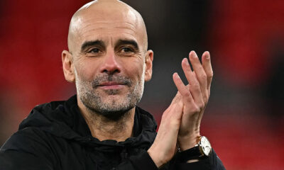 Pep Guardiola celebrates on the touchline during Manchester City’s comeback win over Liverpool at Anfield
