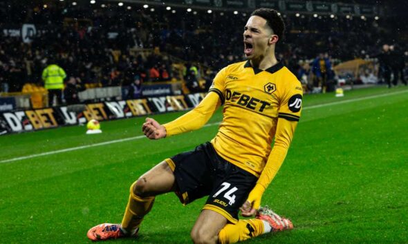 tom edoziе celebrating debut goal for wolves against arsenal at molineux