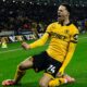 tom edoziе celebrating debut goal for wolves against arsenal at molineux