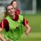 Missy Bo Kearns smiling during an England training session