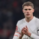 Micky van de Ven in action for Tottenham during Premier League match amid Manchester United and Liverpool transfer interest.
