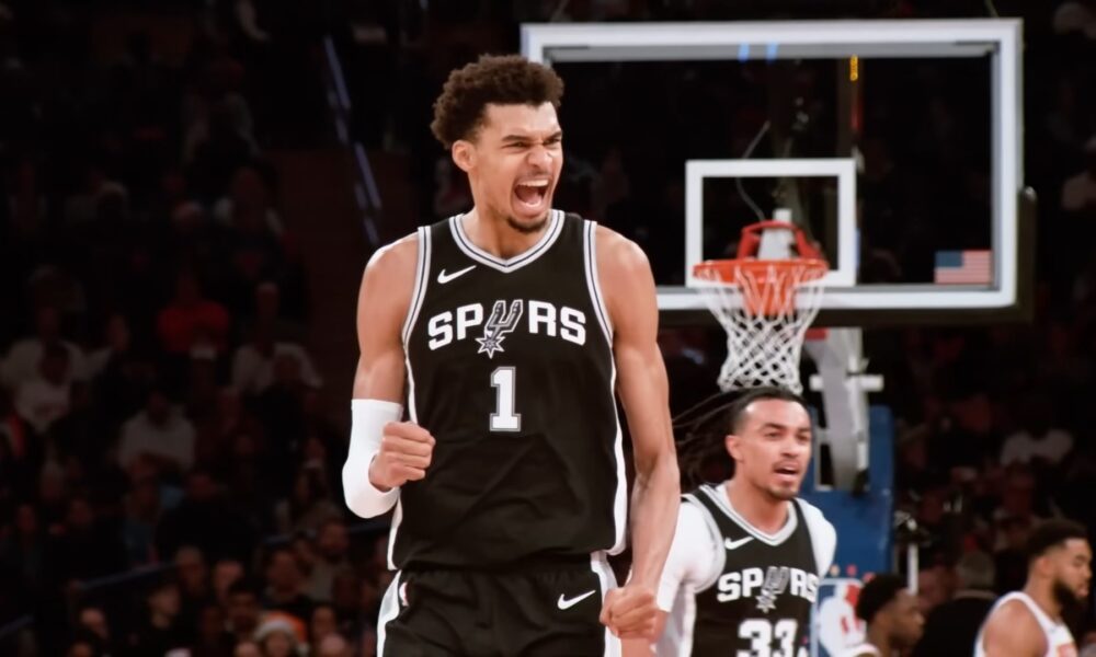 Victor Wembanyama celebrating after scoring during San Antonio Spurs NBA playoff win against Portland Trail Blazers.