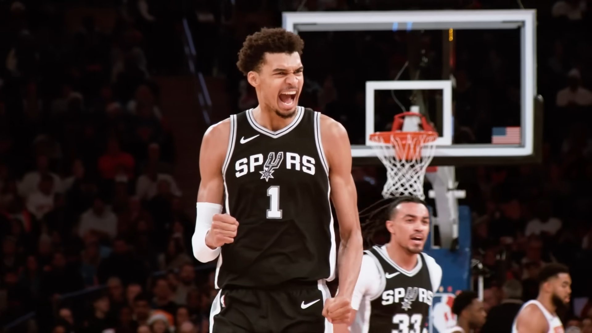 Victor Wembanyama celebrating after scoring during San Antonio Spurs NBA playoff win against Portland Trail Blazers.
