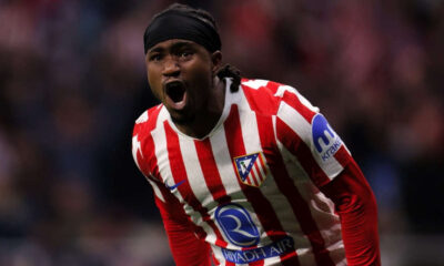 Ademola Lookman in action for Atletico Madrid showing defensive effort and attacking skill.