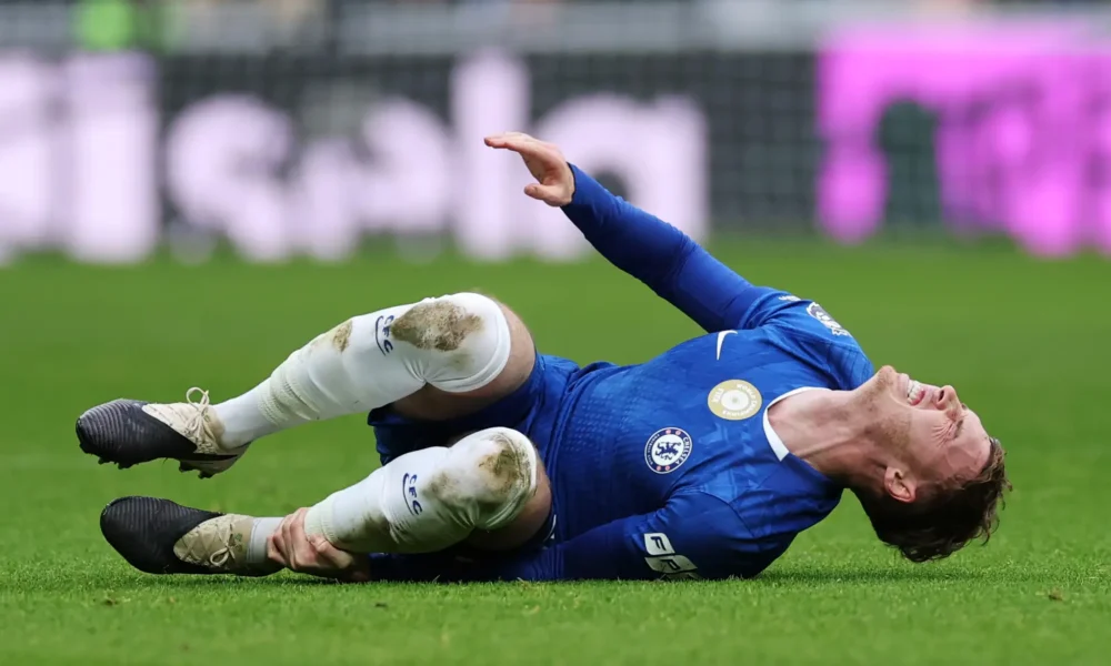 Cole Palmer in action for Chelsea during Premier League match amid injury struggles.