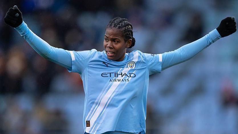 Khadija Shaw celebrating after scoring for Manchester City Women during the WSL season.