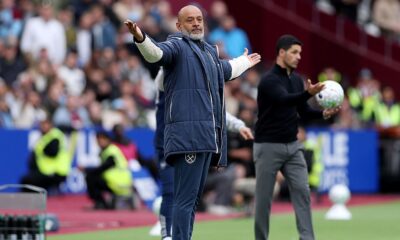 West Ham players protesting after a late goal was disallowed against Arsenal following a VAR review.