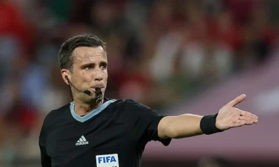 A FIFA referee explaining new football laws ahead of the 2026 FIFA World Cup.