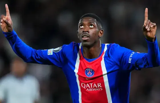 Paris Saint-Germain players wearing the club shirt with two stars above the badge